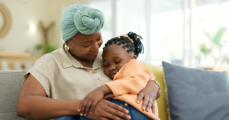 Image showing Mother hug sleeping child on couch for love, care or holding for comfort in lounge at home. Black woman, happy mom and kissing girl kid on lap for nap, rest or support to relax on sofa in living room