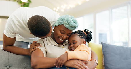 Image showing Black family, relax and parents hug child on sofa at home for bonding, quality time and happiness. Love, lounge and happy mother, father and girl on couch embrace together for care in living room