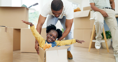 Image showing Father, playing and child in a box while moving house with a black family together in a living room. Man and a girl kid excited about fun game in their new home with a smile, happiness and energy