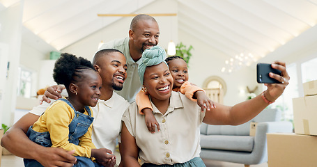 Image showing Moving, happy family and selfie with kids in new home, boxes and people in living room of house. African mother, father and children in self portrait with boxes, real estate and happy investment.