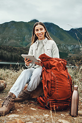 Image showing Tablet, backpack and woman trekking in nature on mountain for adventure, weekend trip or vacation. Digital technology, bag and female person from Canada network on social media and hiking in forest.