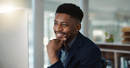 Image showing Businessman, thinking and reading on computer with a smile in office for email, feedback or communication. Working, online or black man with research, inspiration or ideas from Nigeria report or news