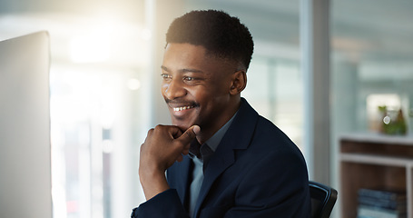 Image showing Businessman, thinking and reading on computer with a smile in office for email, feedback or communication. Working, online or black man with research, inspiration or ideas from Nigeria report or news