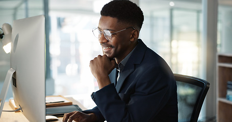 Image showing Thinking, businessman and reading on computer with a smile in office for email, feedback or communication. Working, online or black man with research, inspiration or ideas from Nigeria report or news