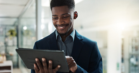 Image showing Tablet, networking and businessman in the office typing a message on the internet or mobile app. Digital technology, chatting and African male lawyer scroll on social media or website in workplace.