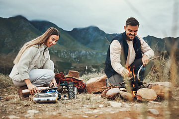 Image showing Couple, camping and fire in nature, mountains and outdoor for sustainable heating, vacation and prepare kettle. Happy man and woman in field with water, campfire or flames for cooking on holiday