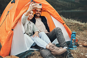 Image showing Couple, tent and camping selfie with smile, memory and holiday, web blog and morning in countryside. Man, woman and relax with vacation, social media post and adventure with love, outdoor and freedom