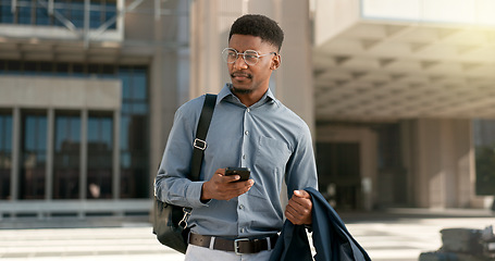 Image showing Man, walking and texting from work, corporate clothes and wondering in city, buildings and outside. Professional, employee and leaving on social media, communicating and thinking of day, text or post