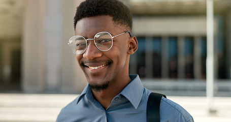 Image showing Business, face and happy black man with glasses in a city for travel, commute or outdoor morning trip. Portrait, smile and confident African male design intern excited to begin new job or career