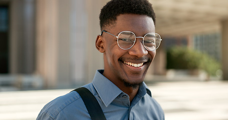 Image showing Business, face and happy black man with glasses in a city for travel, commute or outdoor morning trip. Portrait, smile and confident African male design intern excited to begin new job or career