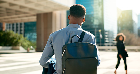 Image showing City, back and business person walking on outdoor urban journey, commute and businessman on way to office building. Backpack, morning and professional agent on morning travel to work in Chicago, USA