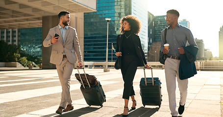 Image showing Business people, team walking and travel with suitcase in city for corporate, job opportunity and networking. Professional woman and men talking at outdoor hotel or on the way to airport with luggage