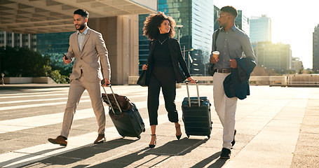 Image showing Business people, team walking and travel with suitcase in city for corporate, job opportunity and networking. Professional woman and men talking at outdoor hotel or on the way to airport with luggage