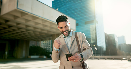 Image showing Walking, phone or businessman winning in city for bonus, financial profit or social media notification. News, yes or happy entrepreneur in celebration of deal victory, online goal or trading success