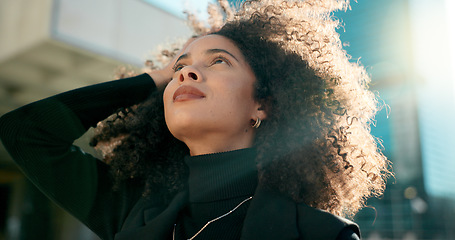 Image showing Face, thinking and wind with a business black woman in the city for growth, opportunity or inspiration. Vision, street and smile with a happy young employee looking around an urban town for ideas