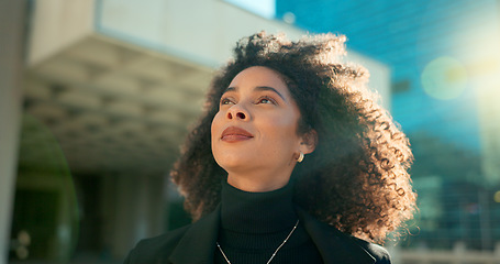 Image showing Face, thinking and wind with a business black woman in the city for growth, opportunity or inspiration. Vision, street and smile with a happy young employee looking around an urban town for ideas