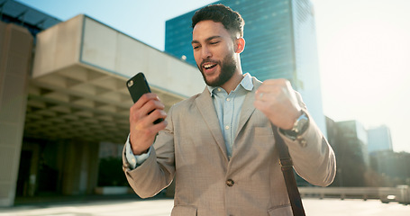 Image showing Walking, phone or businessman winning in city for bonus, financial profit or social media notification. News, yes or happy entrepreneur in celebration of deal victory, online goal or trading success