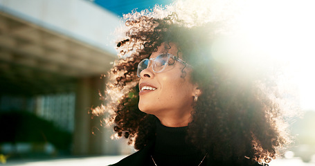 Image showing Face, vision and wind with a business black woman in the city for growth, opportunity or inspiration. Thinking, street and smile with a happy young employee looking around an urban town for ideas