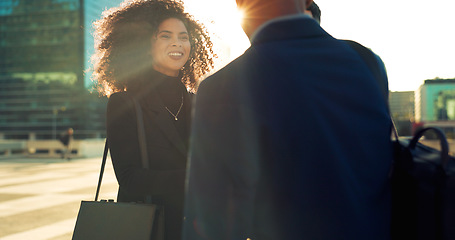 Image showing Business woman, people handshake and city for b2b partnership, outdoor deal and travel meeting or success. Professional employees or clients shaking hands, group introduction or talking in lens flare