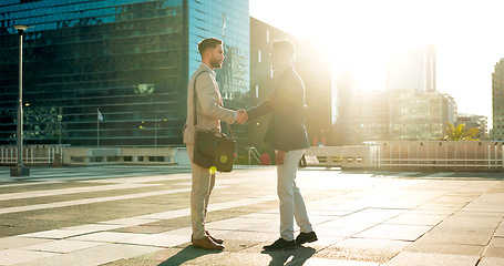 Image showing Teamwork, greeting or business people shaking hands in city for project agreement or b2b deal. Hiring, outdoor handshake or men meeting for a negotiation, offer or partnership opportunity on rooftop