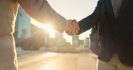 Image showing Teamwork, closeup or business people shaking hands in city for project agreement or b2b deal. Hiring, outdoor handshake or men meeting for a negotiation, offer or partnership opportunity on rooftop