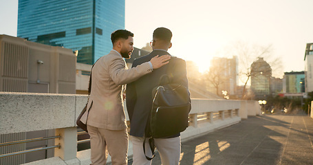 Image showing Business, men and walking in street with support in city for partnership, collaboration and teamwork. Professional, people and outdoor by buildings for travel, commute and conversation and diversity