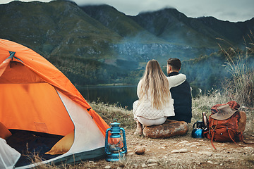 Image showing Couple, hug and relax on mountain camping, adventure or travel in nature and environment. People, tent and bonding together with embrace, support or care and tent in forest and backpacking in woods