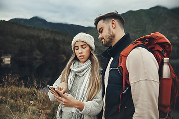 Image showing Couple, phone search and hiking in nature with online information for direction, guide or map on carbon footprint journey, Young people lost in mountains with backpack, travel and check for location