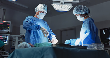 Image showing Doctor, patient and surgery in hospital, nurses and operation ,medical, diagnosis and treatment. Healthcare, sick and scissors for help, surgeon and specialist on bed, working, and operating body