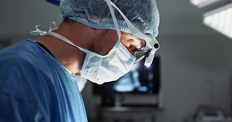 Image showing Surgery, hospital and doctor with face mask for operation, medical emergency and service in theater. Healthcare, procedure and closeup of surgeon with light for patient injury, wellness and accident