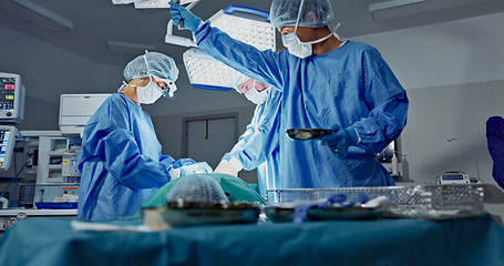 Image showing Doctors, teamwork and surgery in theater with medical support for healthcare, safety and operation at hospital. Surgeon, medicine and team or collaboration with tools for cardiology or emergency