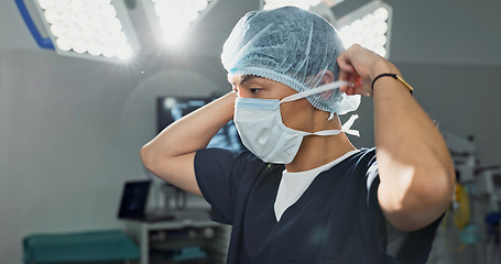 Image showing Surgery, doctor and man with face mask in hospital theatre for medical service, preparation and operation. Healthcare, safety scrubs and person with uniform for emergency, procedure and protection