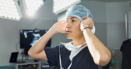 Image showing Surgery, doctor and man with face mask in hospital theatre for medical service, preparation and operation. Healthcare, safety scrubs and person with uniform for emergency, procedure and protection