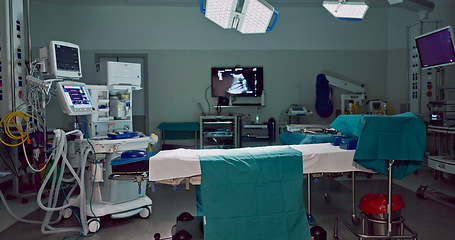 Image showing Empty, dark hospital and room for operation, emergency service and healing patient. Healthcare backgrounds, surgery theatre and interior of bed, machine and medical tools for wellness, help and risk