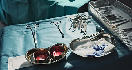 Image showing Surgery, health and metal tools in operation theater, help in medicine for treatment and closeup of equipment. Medical, surgical instrument or scissors at clinic, healthcare background and procedure