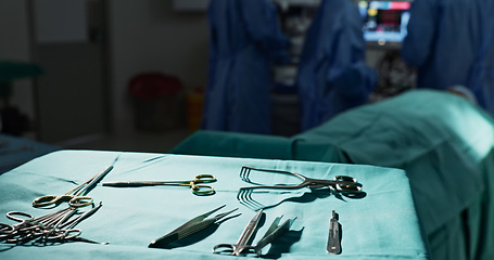 Image showing Surgery, health and tools in operation theatre, help in medicine with treatment and closeup of equipment on table. Metal, medical and surgical instrument with doctor people at hospital for healthcare