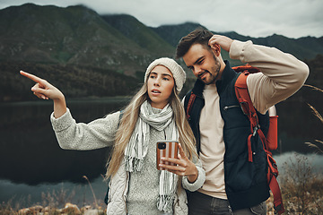 Image showing Hiking, anxiety and lost couple with a phone in nature for direction, map or navigation with stress. Backpacking, travel and people with smartphone app for location search or navigation to campsite