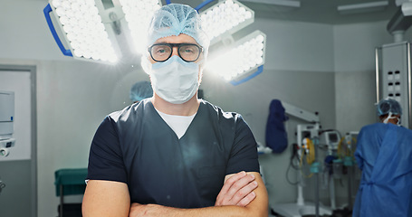 Image showing Surgeon, doctor and man in portrait with arms crossed, healthcare and confidence in operation theater for medical procedure. Surgery, health professional and help in hospital, expert with face mask