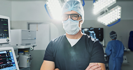 Image showing Surgeon, doctor and man in portrait with arms crossed, healthcare and confidence in operation theater for medical procedure. Surgery, health professional and help in hospital, expert with face mask