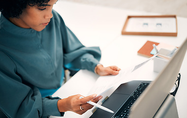 Image showing Woman, laptop and documents in finance, budget planning or invoice for investment or policy at office. Female person, employee or accountant checking paperwork, bills or company expenses at workplace