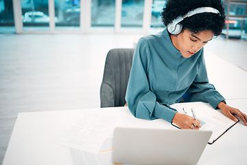 Image showing Headphones, computer and businesswoman writing notes in office doing research for creative project. Notebook, technology and professional female designer work, plan and listen to music in workplace