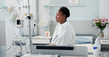Image showing Patient, hospital and happy on bed with recovery, illness and accept diagnosis with treatment plan. Black woman, healthcare and wellness in medical center, bedroom and smiling for doctor and therapy