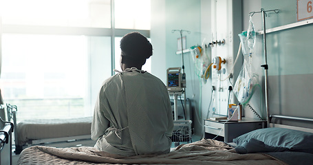 Image showing Patient, hospital and sitting on bed with sad, depression and worry for heart disease diagnosis. Black person, treatment and healthcare in medical center, heart monitor and emergency with therapy