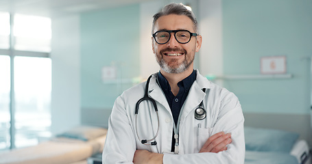 Image showing Healthcare, doctor and man with arms crossed at hospital with smile for support, service and wellness. Medicine, professional and expert with glasses and pride for career, surgery, insurance and care