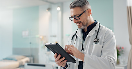 Image showing Healthcare, senior man and doctor with a tablet, typing or research with online results, digital app or internet. Person, employee or medical professional with technology, connection and website info