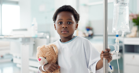 Image showing African child, sick in hospital and teddy bear for healthcare, wellness or treatment on iv drip. Portrait, serious and face of kid in pediatric clinic with toys for recovery from surgery or healing