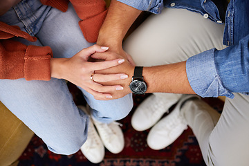 Image showing Couple, holding hands and closeup on couch, care and home with love, bonding and kindness in relationship. Above people, together and support with empathy, trust and respect with solidarity in house