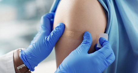 Image showing Doctor, plaster and hands on patient arm for vaccine and healthcare and wellness by injection. Nurse, bandage and closeup of illness prevention, virus protection and immunization or medicine to help