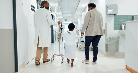 Image showing Hospital, child and doctor while walking, medical and checkup with drip, healthcare and medicine. Hospitalisation, patient and care with help, treatment and diagnosis for health, wellness and virus