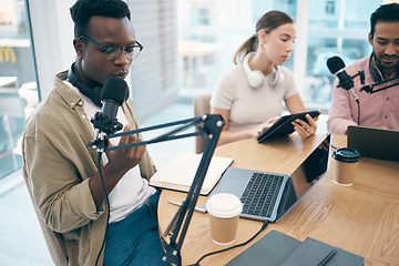 Image showing Man, microphone and podcast or recording, streaming or creative conversation. Diversity, group and black male person or laptop in office for social network, influencer or live online content creating